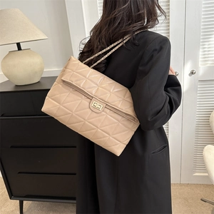 Quilted crossbody bag with gold chain strap in elegant beige leather for women