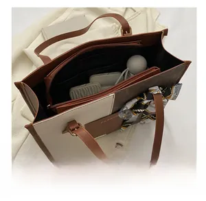 Interior view showing the large capacity and multiple compartments of the fashion tote bag