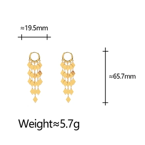 Detailed view of long gold tassel earrings with diamond shapes and size dimensions