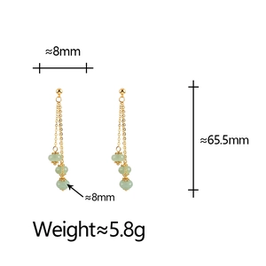 Detailed view of long tassel earrings with green natural stones and 65.5mm length specs