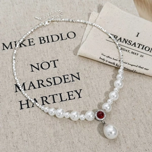 Vintage necklace with red zircon pendant, water drop pearl, and silver beads on linen