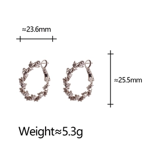 Detail view of coffee gold spiral earrings with precise dimensions and weight specs