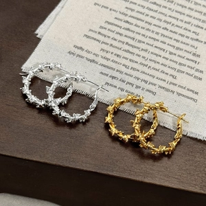 Geometric spiral hoop earrings in coffee gold and silver with textured metal finish