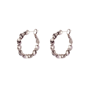 Minimalist silver twisted metal hoop earrings with elegant textured wave design