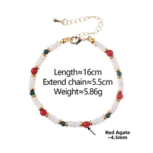 Detail of red agate and peacock-style beads bracelet with gold clasp and extension chain