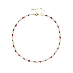 Handmade necklace set with red agate, green beads, and white shells on white background