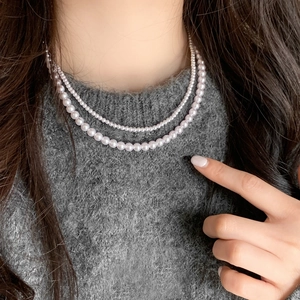 Elegant taro purple double-layer stainless steel pearl necklace on a model