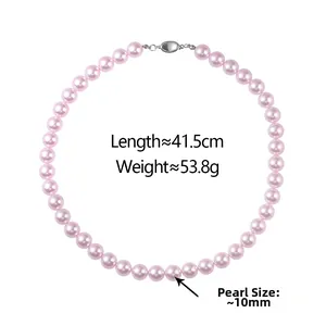 Detail view of pink pearl necklace with dimensions 41.5cm length and 10mm diameter