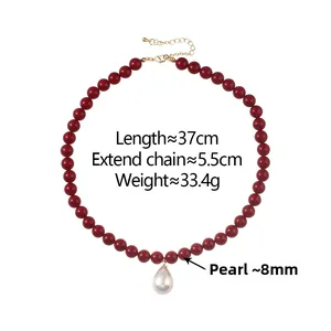 Detail of red beaded necklace with white teardrop pearl pendant and size dimensions