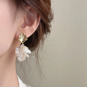 Elegant gold fan-shaped stud earrings with white pearl-like petals and cubic zirconia