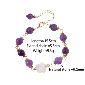 Detail of natural purple stone bead bracelet with white rose charm and gold-plated clasp