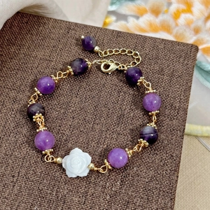 Handmade gold-plated bracelet with purple natural stones and a white rose flower charm