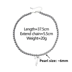 Gray pearl necklace featuring silver bow pendant and 37.5cm length measurements