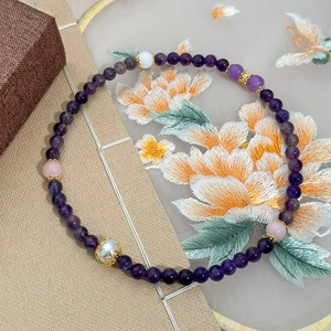 Handmade multilayered natural stone bracelet with purple beads and white pearls