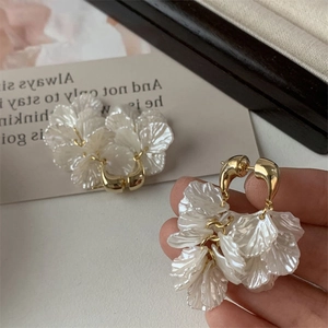 Elegant white layered petal tassel earrings with gold finish for a sophisticated look