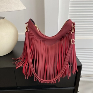 Deep red bohemian tassel half-moon bag with gold zippers and detachable shoulder strap