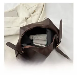 Internal view of a large dark brown tote bag showing ample space for daily essentials