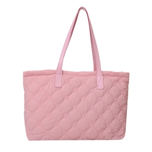 Pink quilted cotton tote bag with diamond stitching and leather handles on white background