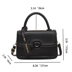 Detail view of black leather crossbody bag with square metal buckle and measurements