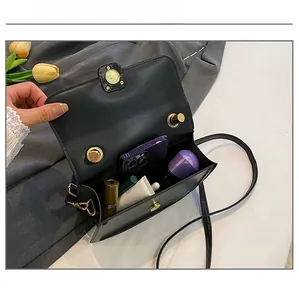 Interior view showing the storage capacity of this elegant black crossbody bag
