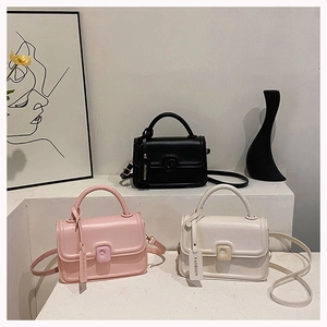 Detailed group view of vintage square crossbody bags in black, pink and beige leather