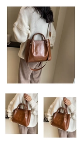 Dettaglio della borsa a secchiello vintage marrone con ampia tracolla etnica intrecciata