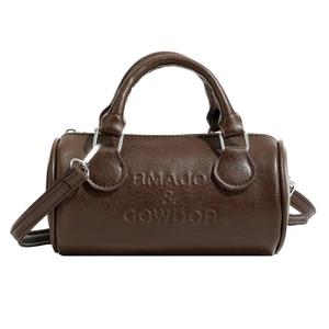 Dark brown embossed leather Boston bag with top handles and a crossbody strap