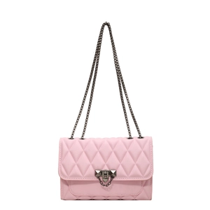 Pink quilted crossbody bag with rhombic stitching and gunmetal chain strap for women