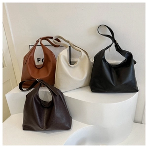 Detailed display of four textured faux leather hobo bags in brown, beige, black, and coffee