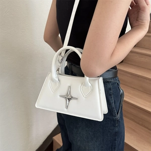 Minimalist white leather crossbody square bag with star metal ornament on model