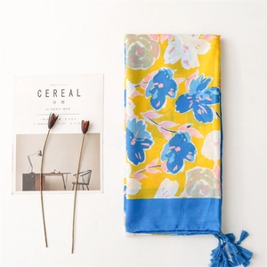 Floral print cotton scarf shawl with bold yellow and blue contrast and fringe tassels