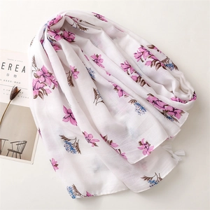 Exotic floral cotton linen shawl with pink flowers and fringe tassels on white