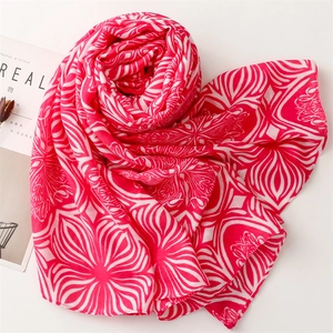 Red and white floral geometric cotton linen scarf with tassels displayed on a white background