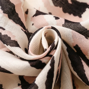 Close-up of lightweight linen leopard scarf showing pink zebra print texture and soft weave