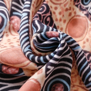 Macro shot of cotton linen scarf texture with ethnic patterns and tassel details