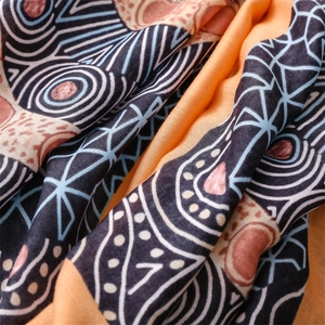 Detailed view of bohemian cotton linen scarf with ethnic patterns and soft texture