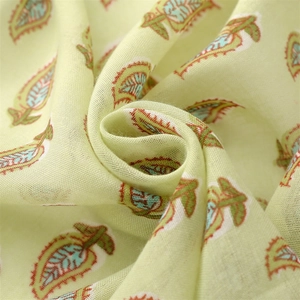 Detailed texture of light green beach shawl with soft cotton-linen feel and leaf pattern