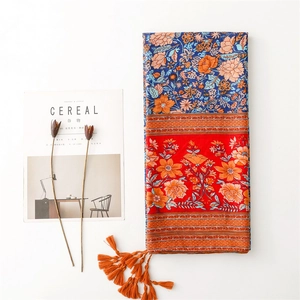 Ethnic style cotton linen scarf with red blue floral patterns and orange tassels