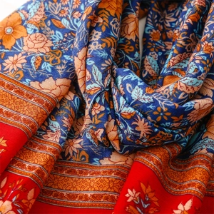 Close-up of red and blue bohemian floral pattern cotton linen pashmina shawl scarf