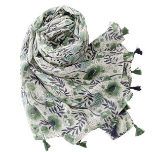 Floral cotton linen scarf with green leaf print and blue fringe tassels on white background