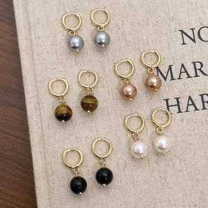 Set of five elegant geometric hoop earrings with assorted colorful pearl drop pendants