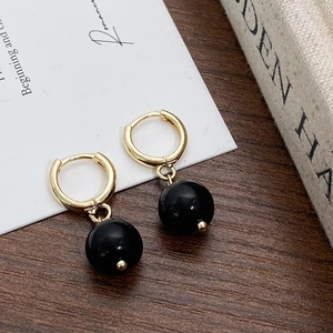 French vintage style earrings with gold clasp and large glossy black round pearl pendants