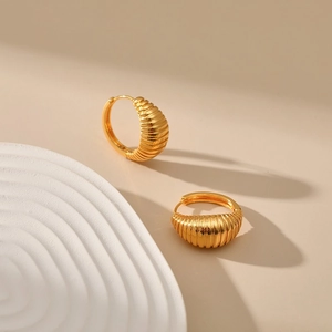 Vintage croissant style huggie hoop earrings with textured gold plating for women