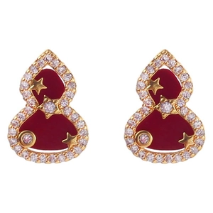Gourd earrings with red enamel and gold stars surrounded by white zircons on white background