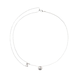 Adjustable minimalist silver necklace featuring dual sphere pendants with brushed texture
