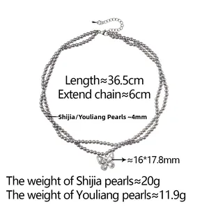 Detailed view of double-layer pearl necklace with butterfly pendant and size measurements