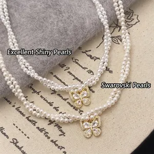 Double-layer pearl necklace with gold butterfly zircon pendant on aesthetic background
