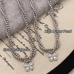 Double-layer pearl necklace with butterfly zircon pendant and 14k gold-plated finish