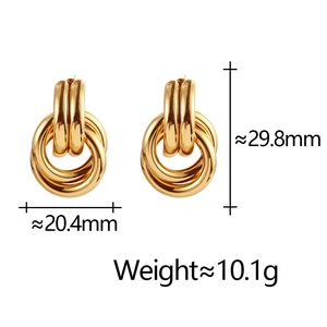 Detail view of geometric multilayer gold earrings with dimensions and weight specs
