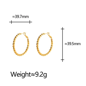 Macro shot of gold twist hoop earrings showing 39.7mm diameter and 9.2g weight details
